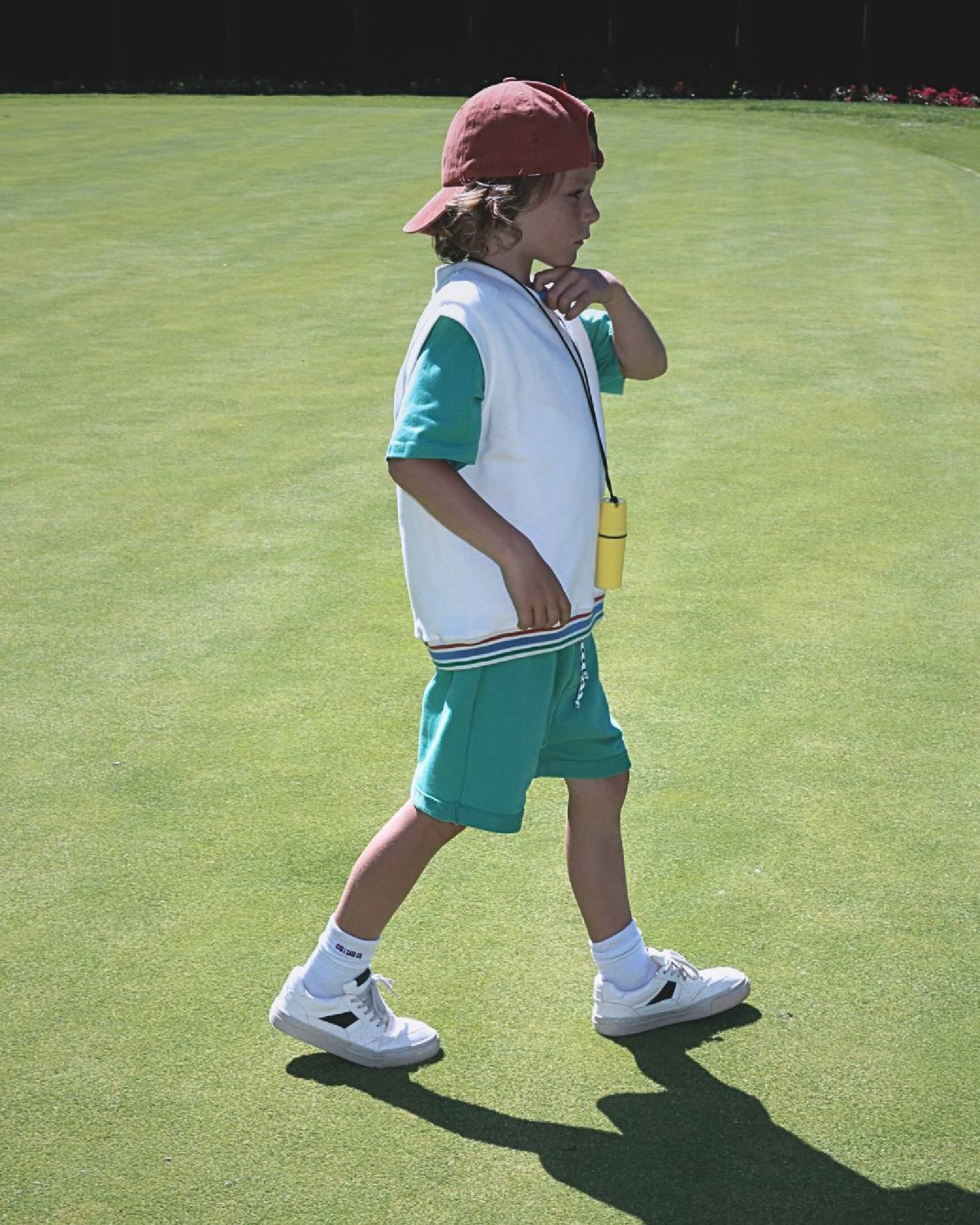 Boy model wearing the Tennis Debardeur with Jog Shorts in Spruce Green.