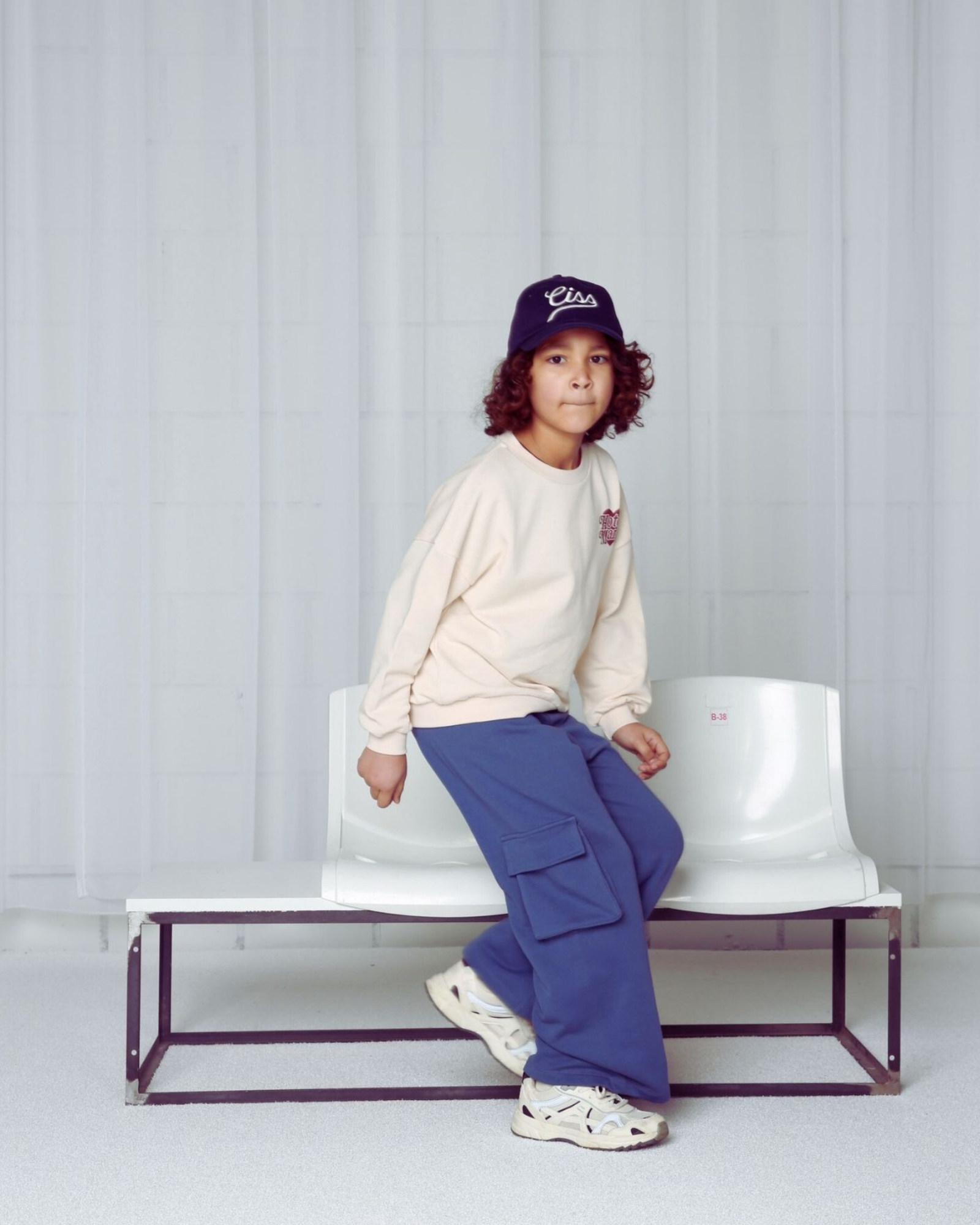 Boy wearing the Hotel Mama Sweater in Crystal Gray in high quality Organic Cotton.