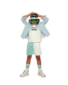 Boy model wearing T-shirt Happy Human in Aqua Glass and the Jog Shorts in Color Block with the Logo socks  in White.