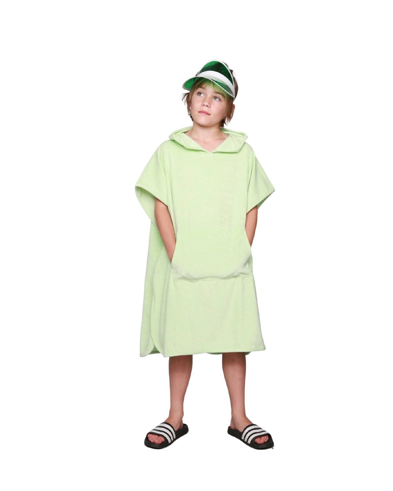 Boy model wearing the Towel Poncho in Paradise Green.